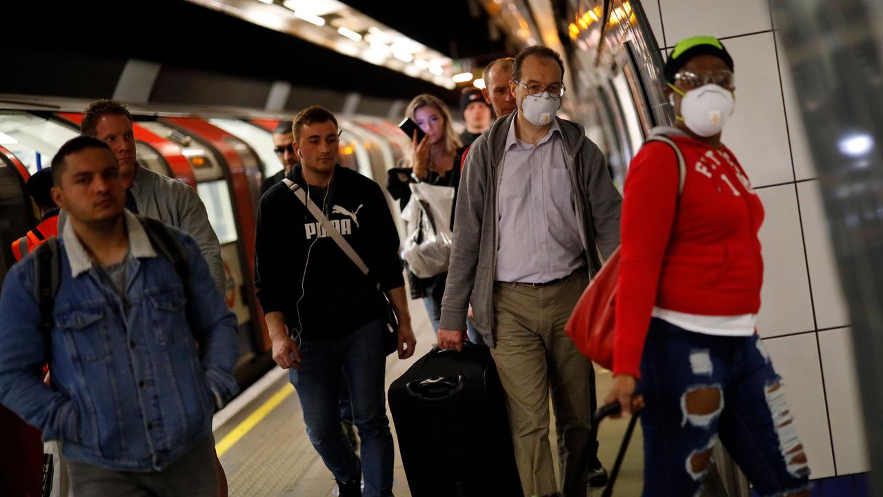 Commuters have been spotted wearing personal protective equipment while riding the tube in London during lockdown. Picture: Tolga Akmen/AFP