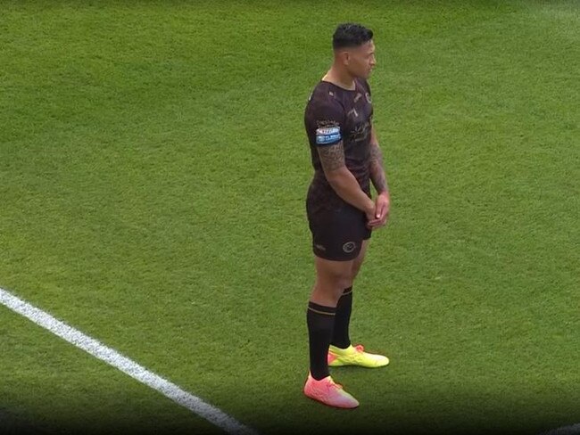 Israel Folau stands up during the moment of reflection