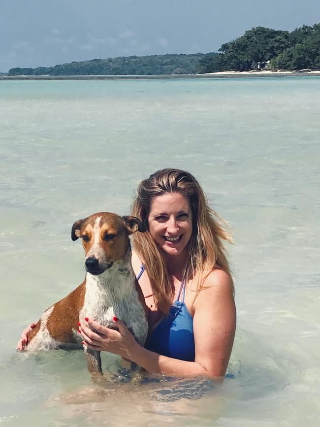 Taxi the dog with his soon to be owner Liza-Jane Sowden in Santo, Vanuatu.