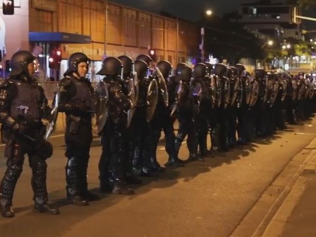 Riot police form a line outside Melbourne Pavilion. Picture: Erik Anderson