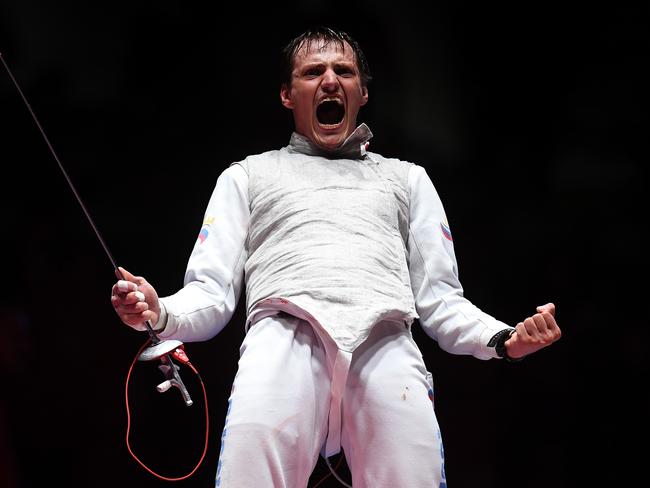 RIO DE JANEIRO, BRAZIL - AUGUST 12: Alexey Cheremisinov of Russia celebrates winning gold in the Men's Team Foil event on Day 7 of the Rio 2016 Olympic Games at Carioca Arena 3 on August 12, 2016 in Rio de Janeiro, Brazil. (Photo by Laurence Griffiths/Getty Images)