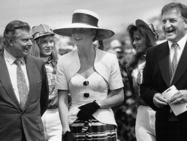 The Duchess of York – formerly Sarah Ferguson — speaks with Bart Cummings and John Elliott while attending the race in 1990.