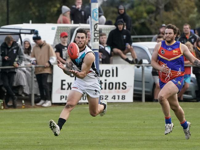 Ryan Wiggins playing for Cygnet against Huonville on Saturday April 17th. Photo courtesy of David Clark Photos.