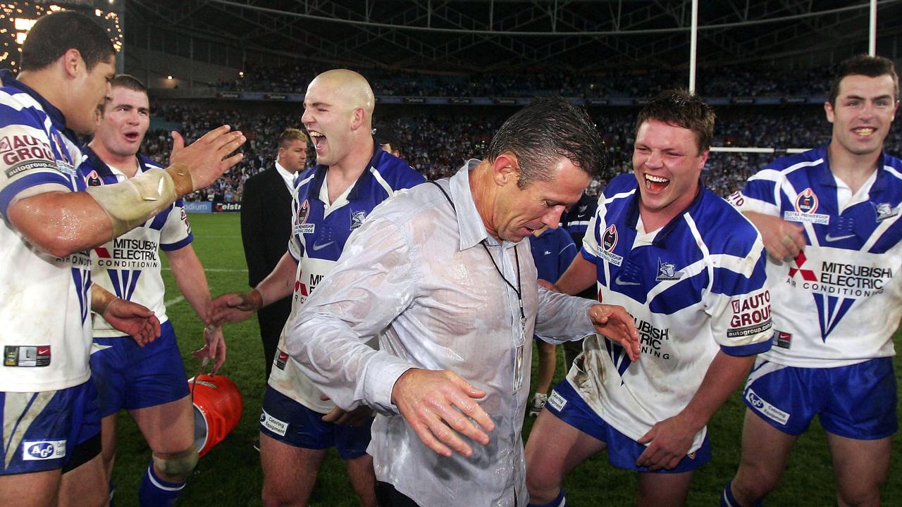 Bulldogs coach Steve Folkes stands dripping after being dumped with Gatorade. (Photo by Chris McGrath/Getty Images)