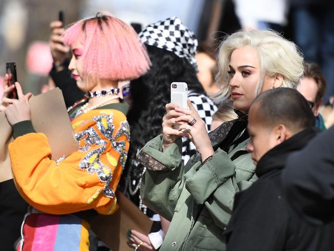 Katy Perry takes pictures of models on the runway for the Marc Jacobs collection during New York Fashion Week on February 16, 2017, in New York City. Picture: AFP
