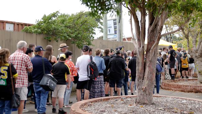 Fans line up outside for the Hillcrest tribute game between Richmond and Hawthorn at Devonport. Picture: Grant Viney