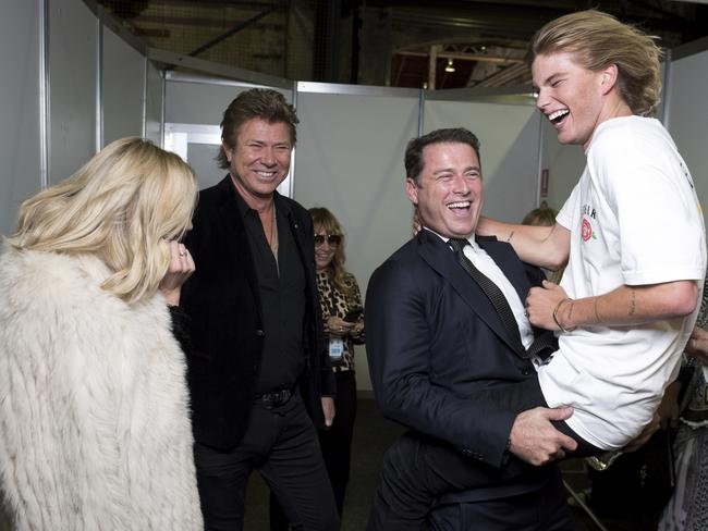 Cheeky moment! Karl Stefanovic with model Jordan Barrett (far right), as Jasmine Yarbrough and Richard Wilkins look on. Picture: Sweaty Betty