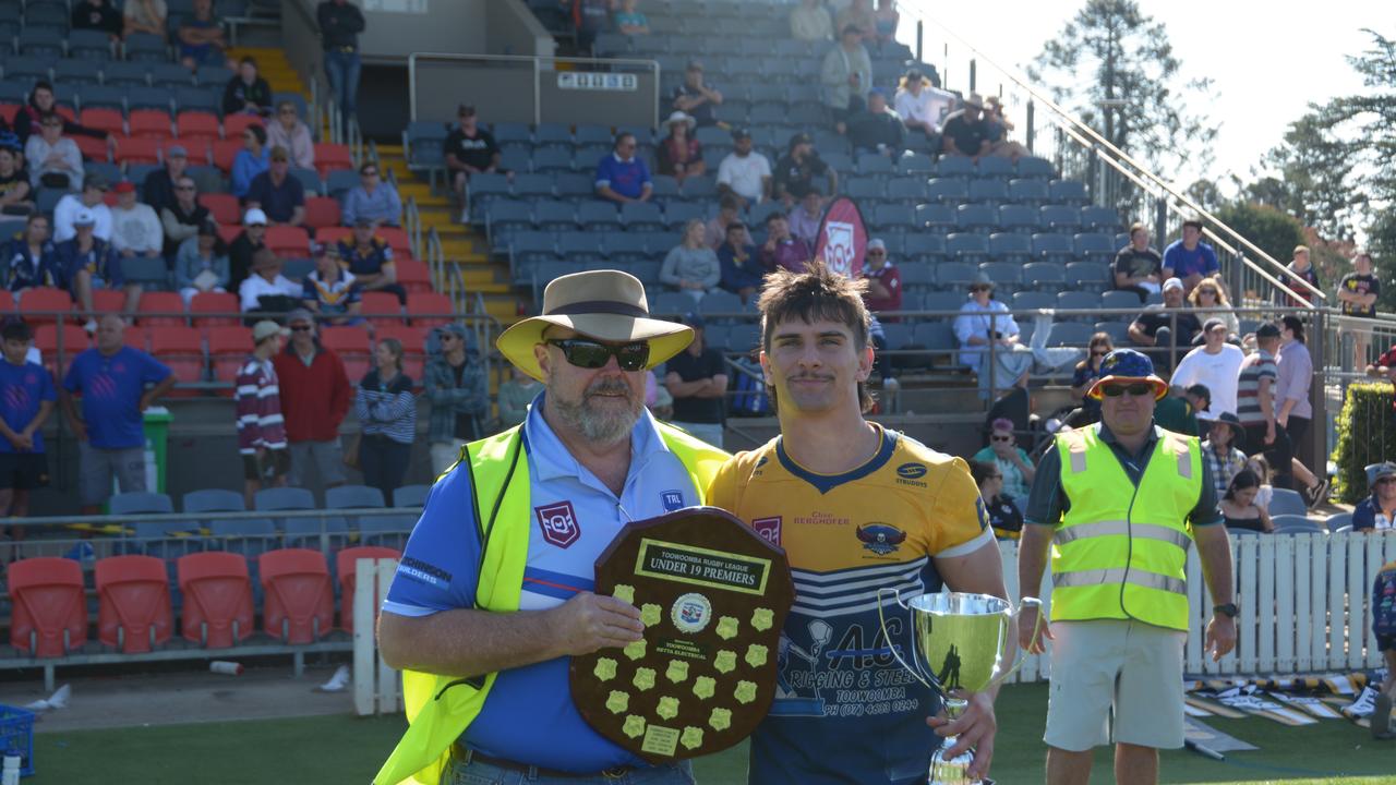 Highfields Eagles Under 19 captain Declan Ryan with receives the trophy on TRL grand final day at Clive Berghofer Stadium on Saturday September 16, 2023.