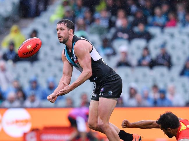 Port Adelaide’s Travis Boak handballs during the Round Nine match against Gold Coast at Adelaide Oval on Sunday. Picture: AAP Image/David Mariuz