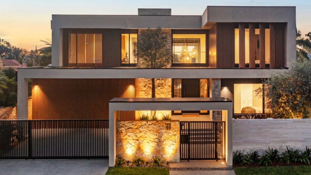 A 50-year-old olive tree is a centrepiece of the striking stone and timber facade