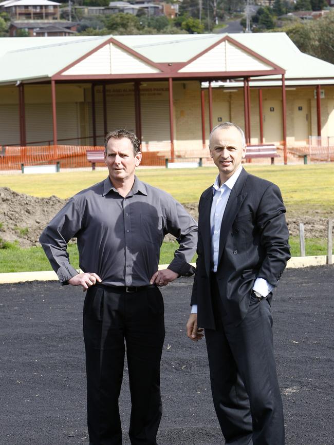 City of Greater Geelong’s senior capital projects officer Garry Condon and Cr Stretch Kontelj standing on the mud base of the new turf wicket at King Lloyd Reserve in 2009.