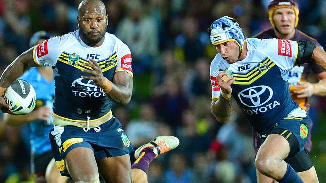 Cowboy's Robert Lui and Johnathan Thurston in action against the Broncos.