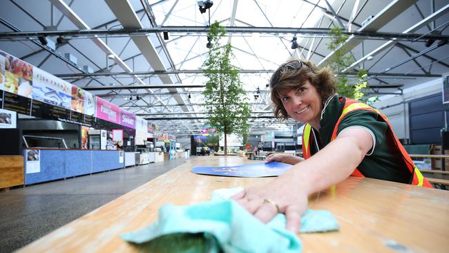 Cascade Brewery’s Lisa Kean prepares tables for advertising decals in Princes Wharf 1 for the Taste of Tasmania. Picture: SAM ROSEWARNE