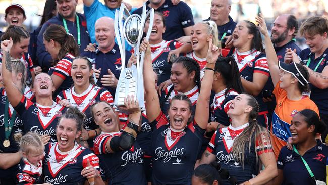 SYDNEY, AUSTRALIA - OCTOBER 06:  Isabelle Kelly and Jessica Sergis of Roosters pose with the NRL Women's Premiership Trophy after winning the NRLW Grand Final match between Sydney Roosters and Cronulla Sharks at Accor Stadium on October 06, 2024, in Sydney, Australia. (Photo by Cameron Spencer/Getty Images)