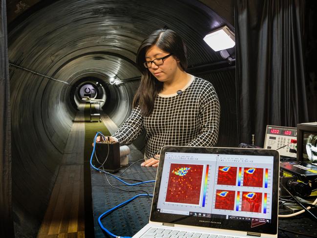 Defence Science and Technology researcher, Joyce Mau, setting up the new Single Photon Avalanche Diode camera for low light and 3D imaging in the testing tunnel at Defence Science and Technology's Edinburgh facility. *** Local Caption *** Defence Science and Technology have developed a Single Photon Avalanche Diode (SPAD) photon detector that is able to perform photon counting or photon timing. Photon counting enables imaging in low light while photon timing measures the time of flight of a laser pulse to provide distance information. In particular, photon timing can be used for 3D imaging where it has applications in long range imaging and underwater surveying that can help increase situational awareness for defence personnel in the field. This is done by mounting the system onto a UAV to perform 3D imaging of remote and hostile areas.