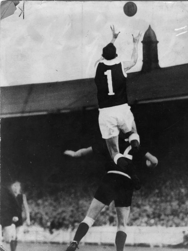 Footballer Ian McKay taking a mark over Pat Hall. Picture: Bill Teubner