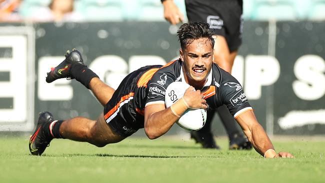 Daine Laurie of the Tigers scores try during the NRL trial between Wests Tigers and Manly Sea Eagles at Leichhardt Oval (Photo by Mark Kolbe/Getty Images).