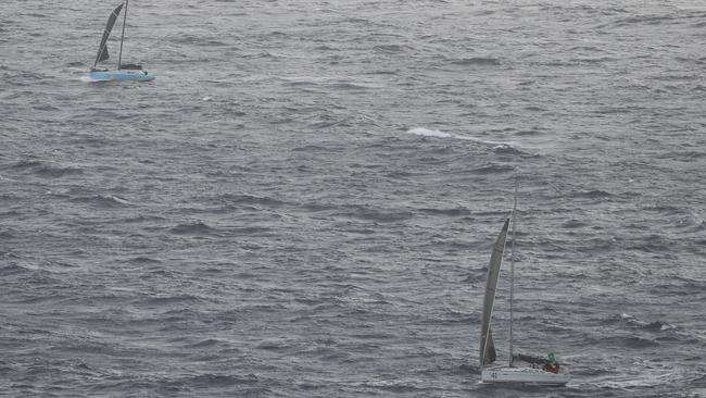 Battered boat motoring home after being hit by big waves and winds. Pic: John Grainger