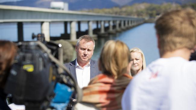 Deputy Premier Jeremy Rockliff and former Lyons candidate Jessica Whelan next to the Sorell Causeway for a roads funding announcement during the last federal election campaign. Picture: RICHARD JUPE