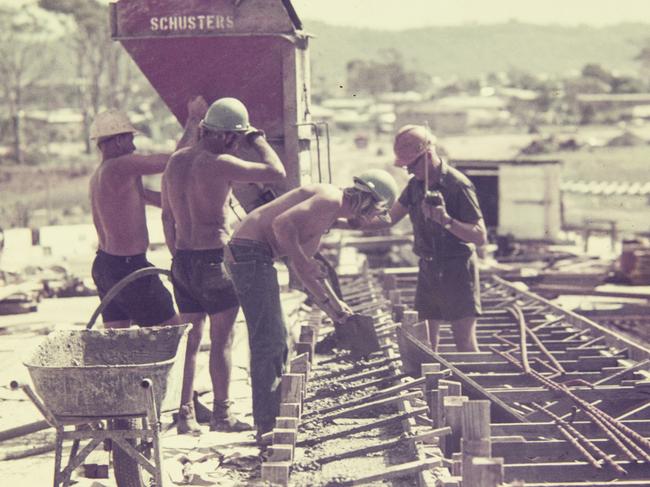 Four men working on a concrete pour during construction of the Riverside Expressway, Brisbane. Photo: Gordon Foot/State Library of Queensland