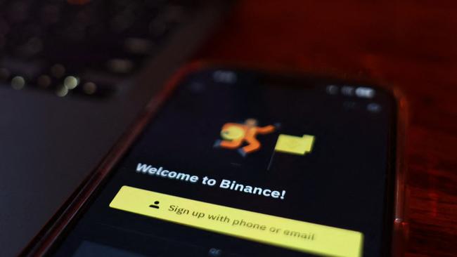 (FILES) In this file photo illustration taken on November 9, 2022, the Binance app is seen on a phone in Atlanta, Georgia. - A top US markets regulator on March 27, 2023, charged cryptocurrency giant Binance and its founder Changpeng Zhao for multiple violations, in another move by Washington against the once high-flying sector. (Photo by Michael M. Santiago / GETTY IMAGES NORTH AMERICA / AFP)