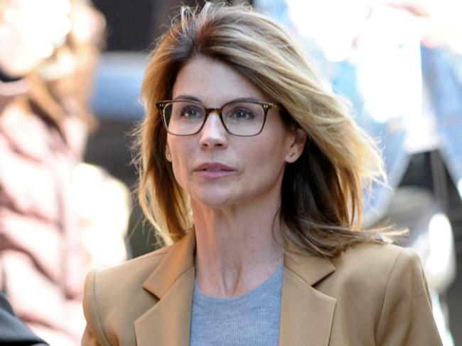 (FILES) In this file photo taken on April 03, 2019, actress Lori Loughlin arrives to face charges for allegedly conspiring to commit mail fraud and other charges in the college admissions scandal at the John Joseph Moakley US Courthouse in Boston. - American actress Lori Loughlin on May 22, 2020 accepted potential prison time by pleading guilty to conspiracy to commit fraud in connection with her role in a sprawling college admissions scandal. (Photo by Joseph Prezioso / AFP)