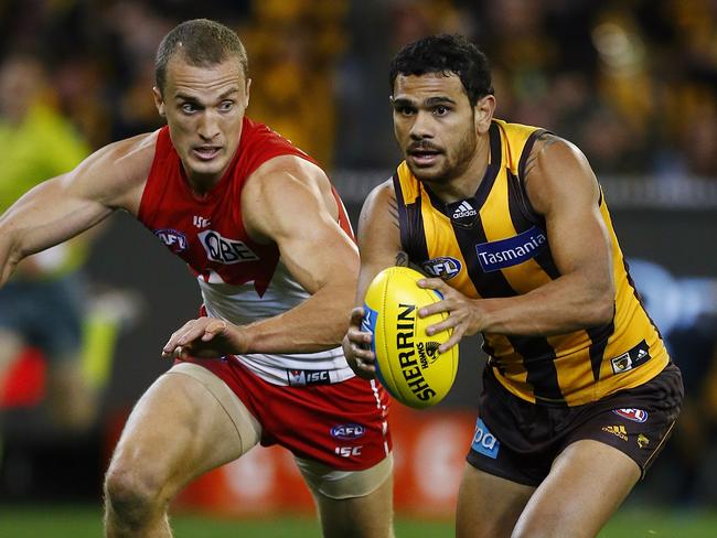 Ted Richards tries to chase down Cyril Rioli at the MCG last year. Picture: Wayne Ludbey