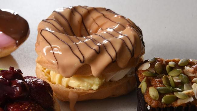 Gumnut Bakery’s cream filled doughnuts almost look too good to eat. Photo: Steve Holland