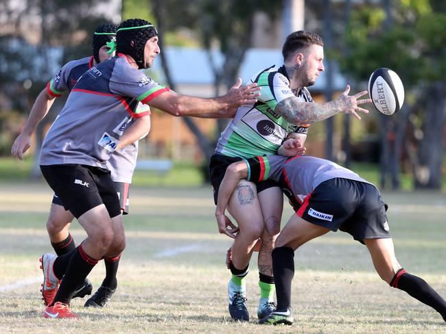 Gold Coast District Rugby Union match between Coolangatta Tweed Barbarians and Palm Beach Currumbin Alleygators (green). Photo of Tama Voyce off-loading. Photo by Richard Gosling (GCDRU)