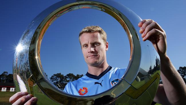 Veteran striker Matt Simon will stay with Sydney FC.