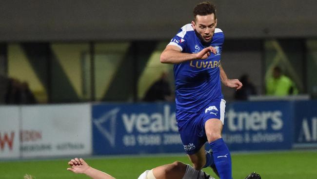 South Melbourne’s Matthew Foschini evades a Dandenong City opponent during the pair’s FFA Cup qualifying match. PHOTO: Tony Gough