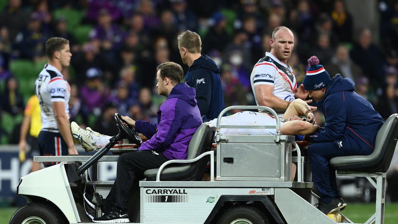 Victor Radley of the Roosters is taken off the field by a stretcher. Photo by Quinn Rooney/Getty Images