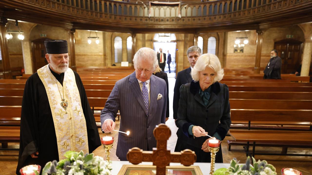 Prince Charles, Prince of Wales and Camilla, Duchess of Cornwall, light candles at the Ukrainian Catholic Cathedral, next to bishop Kenneth Nowakowski. Picture: Getty Images.