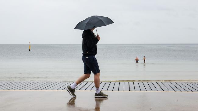 Melbourne gets soaked as a large rain band crosses the state in January. Picture: Ian Currie