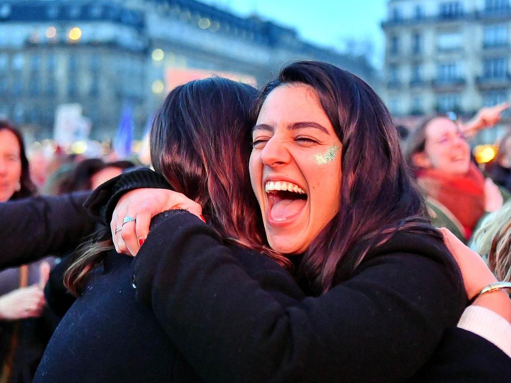 People gather near the Eiffel Tower during the broadcasting of the convocation of both Houses of Parliament to anchor the right of abortion in the country's constitution. Picture: Karim Ait Adjedjou/ABACAPRESS.COM/AAP