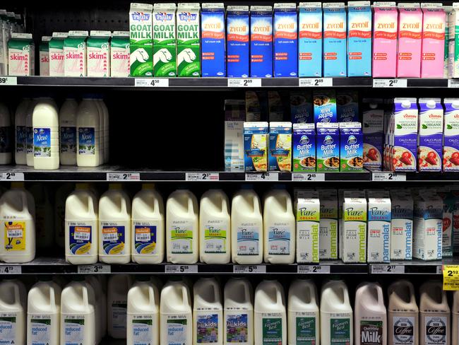 Milk lines the refrigerator shelves at a supermarket in Sydney on Monday, May 7, 2012. (AAP Image/Paul Miller) NO ARCHIVING