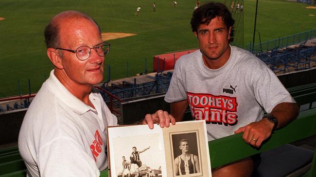 Feb96- John Beveridge former footballer pictured with his son Luke holds a some old photos of his father Jack who played for Collingwood in the 30's. Luke will play for St.Kilda like his father./afl/aussie rules football