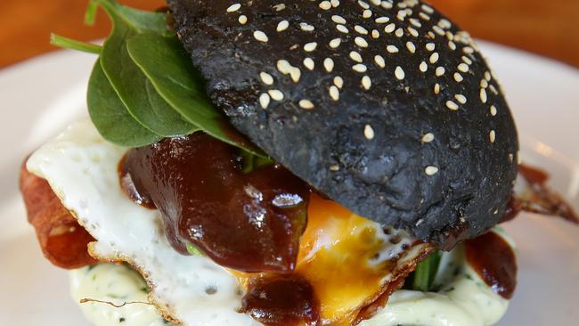 If you like carbon with your bacon and egg roll, try Rukus’ lump of coal roll. Picture: Martin Lange