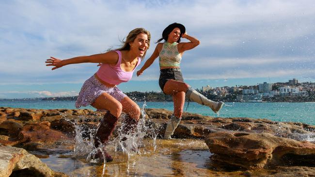 Claudia Jovanovski and Deborah Bodsworth enjoy a splash at North Bondi wearing My Tribe Boots. Picture: Justin Lloyd