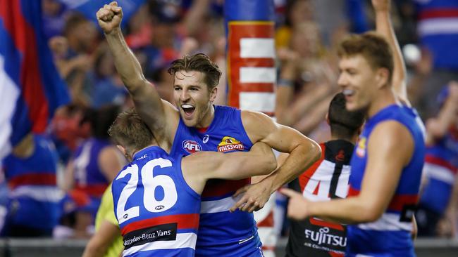 Marcus Bontempelli celebrates a goal against Essendon.