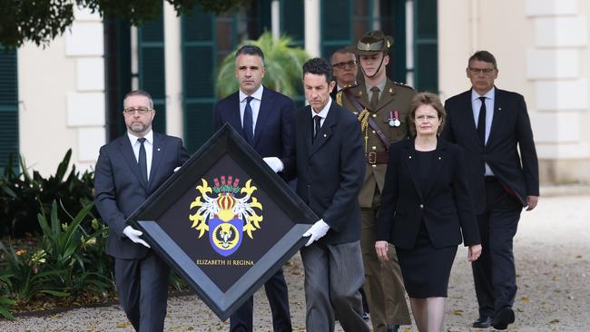 Her Excellency the Honourable Frances Adamson AC and Premier Peter Malinauskas during the ceremony of the hanging of the hatchment, on the front gates of Government House. NCA NewsWire / David Mariuz