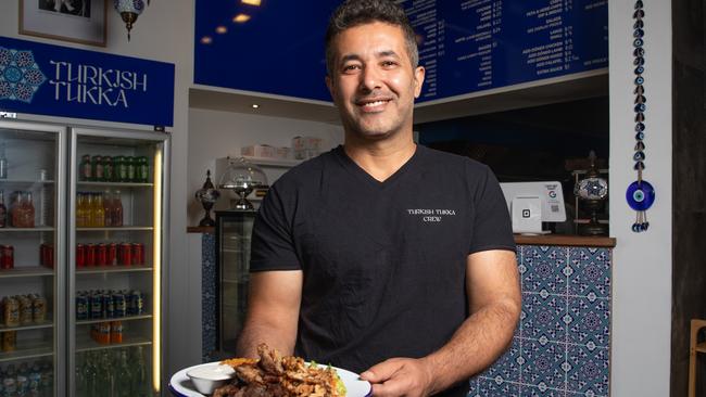 Turkish Tukka co-owner Yusuf Karazor with a mixed plate of marinated rotisserie lamb and chicken, served with bulgur wheat, mixed salad and a garlic and mint yoghurt sauce. Picture: Linda Higginson