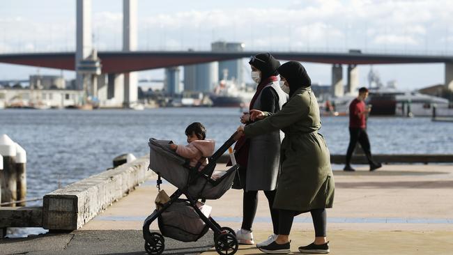 A family exercising in Docklands on Sunday. Picture: NCA NewsWire/Daniel Pockett