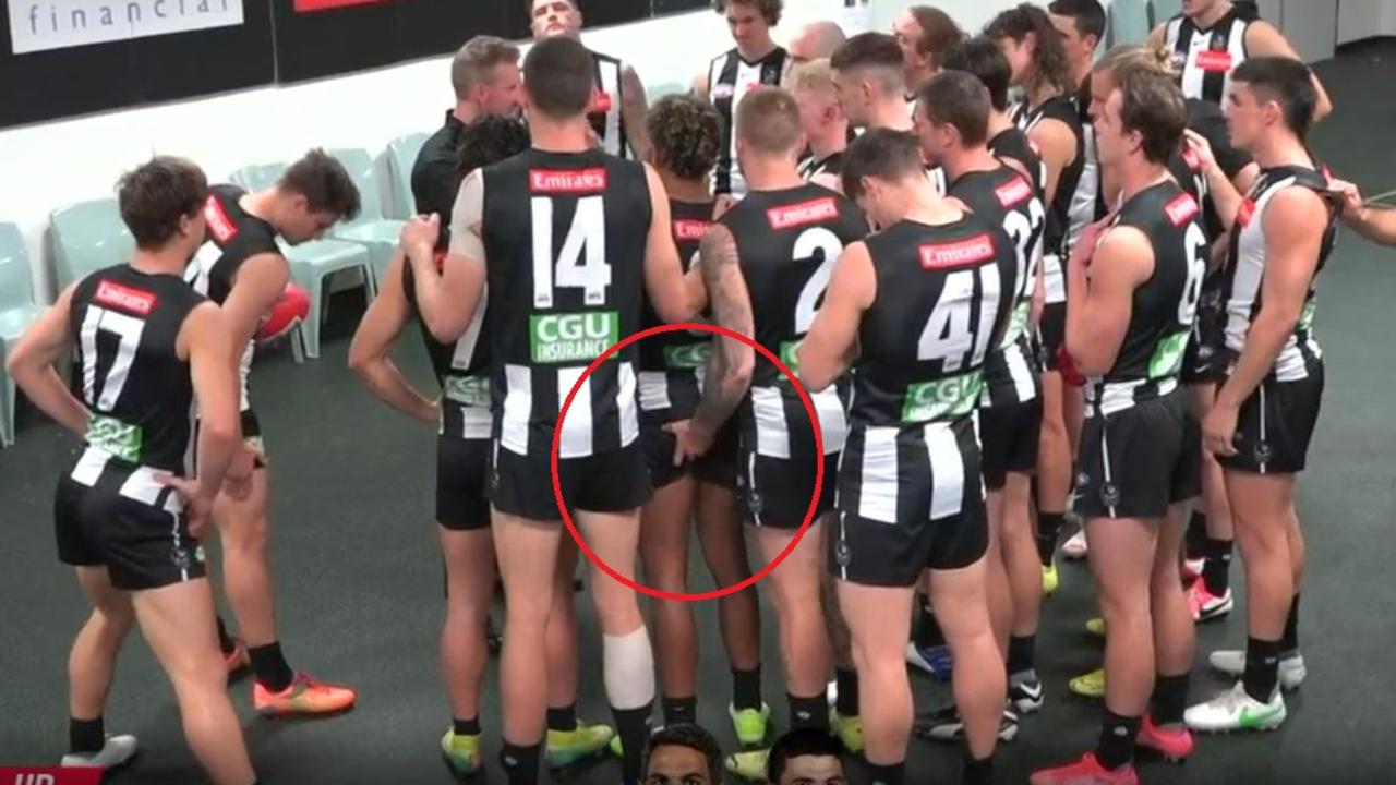 Collingwood's Jordan De Goey touches Isaac Quaynor before the game.