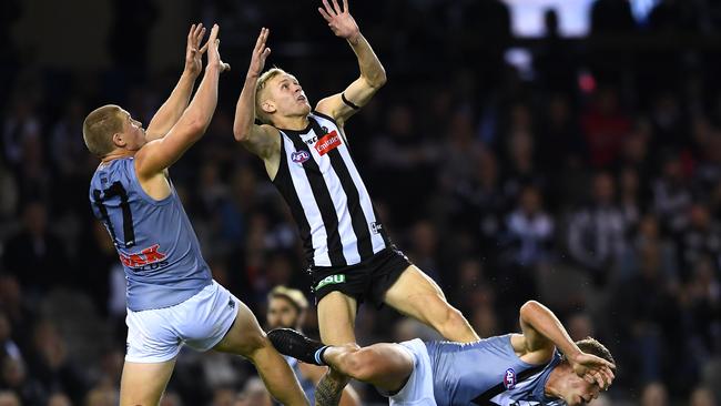 Tom Clurey of the Power and Jaidyn Stephenson of the Magpies compete for a mark during the round seven AFL match. Picture: Getty Images