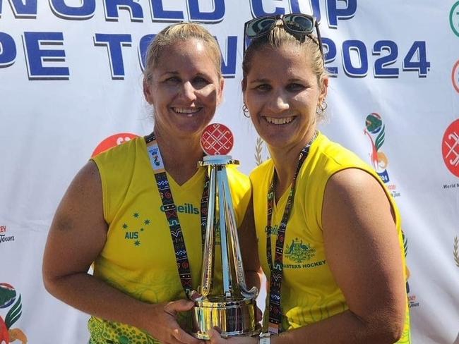 Sisters Kim Reibel and Toni Chirio with the cherished Masters World Cup trophy.