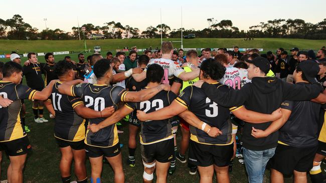 Penrith players join with their Warringah rivals after fulltime in Saturday’s game. Picture: Karen Watson.