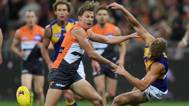 Lachie Whitfield pushes Brad Sheppard aside. Picture: AAP