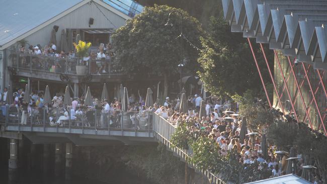 Thousands of people lined the restaurants, bars and lookouts along the riverbank including at Howard Smith Wharves. Picture: NewsWire/ Richard Gosling