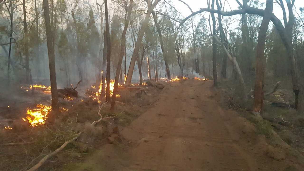 A Cambooya Rural Fire Brigade volunteer took these photos while fighting the Forest Ridge and Cypress Gardens fire, yesterday, December 4. Picture: Contributed